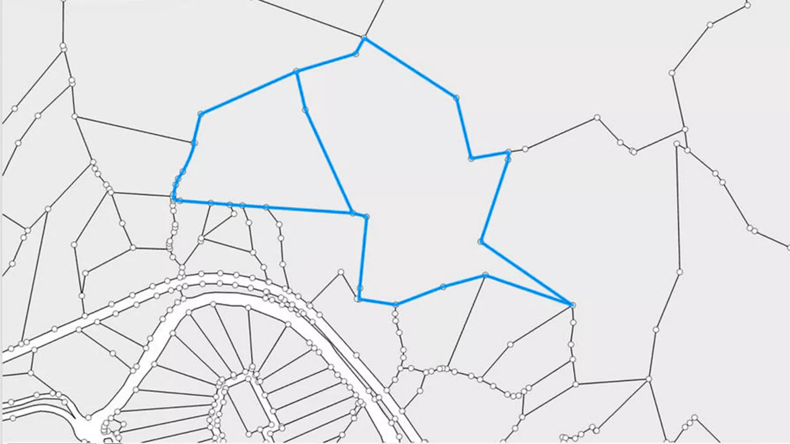 Carte représentant un réseau de lignes et de nœuds, avec un grand polygone irrégulier mis en surbrillance en bleu.