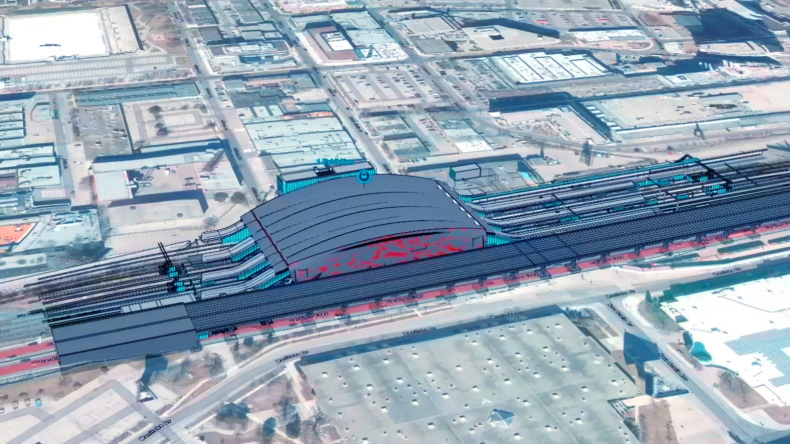 Vue aérienne d’un plan de conception structurel pour une gare ferroviaire. Il montre la manière dont la gare s’intégrera dans l’environnement urbain avoisinant.