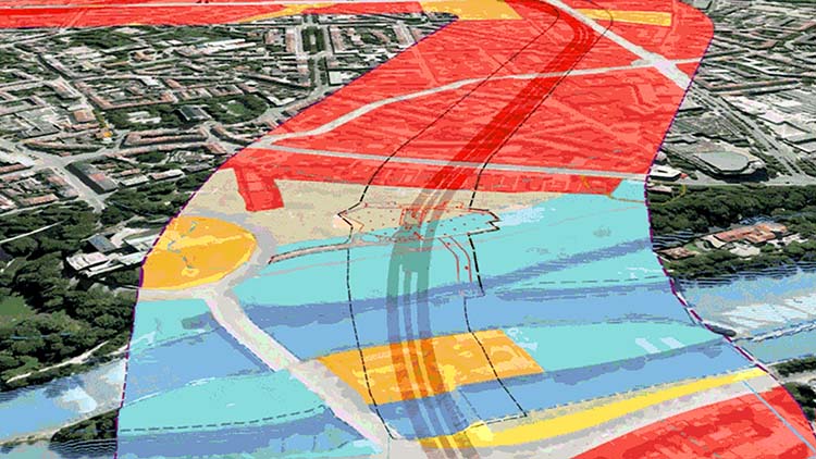Visuel de l’intégration SIG et BIM montrant une superposition de projet d’infrastructure codée par couleur sur un paysage