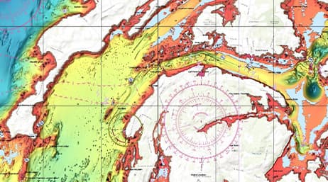 Carte de navigation colorée recouverte de marquages correspondant à une boussole