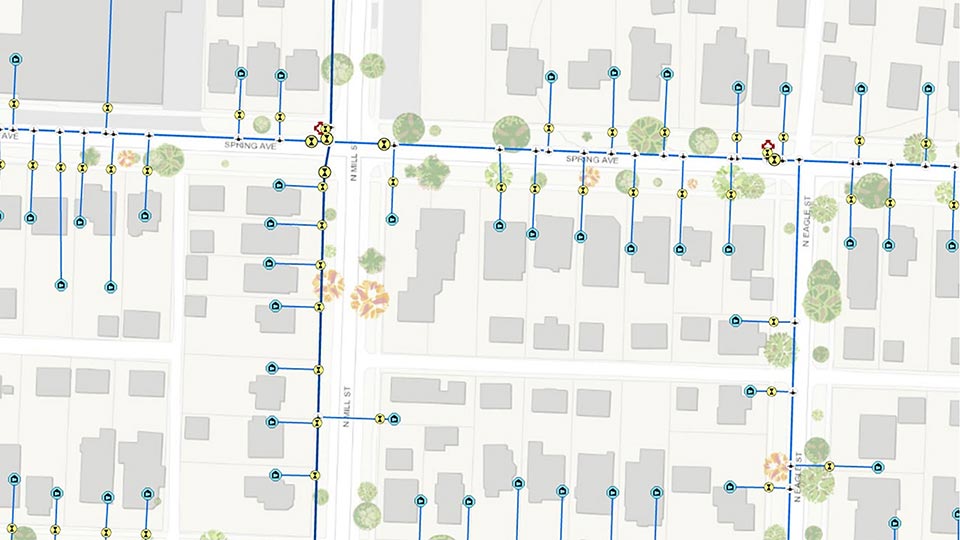 Série de lignes connectée bleues et de zones grises représentant une carte d’un réseau électrique dans un quartier résidentiel