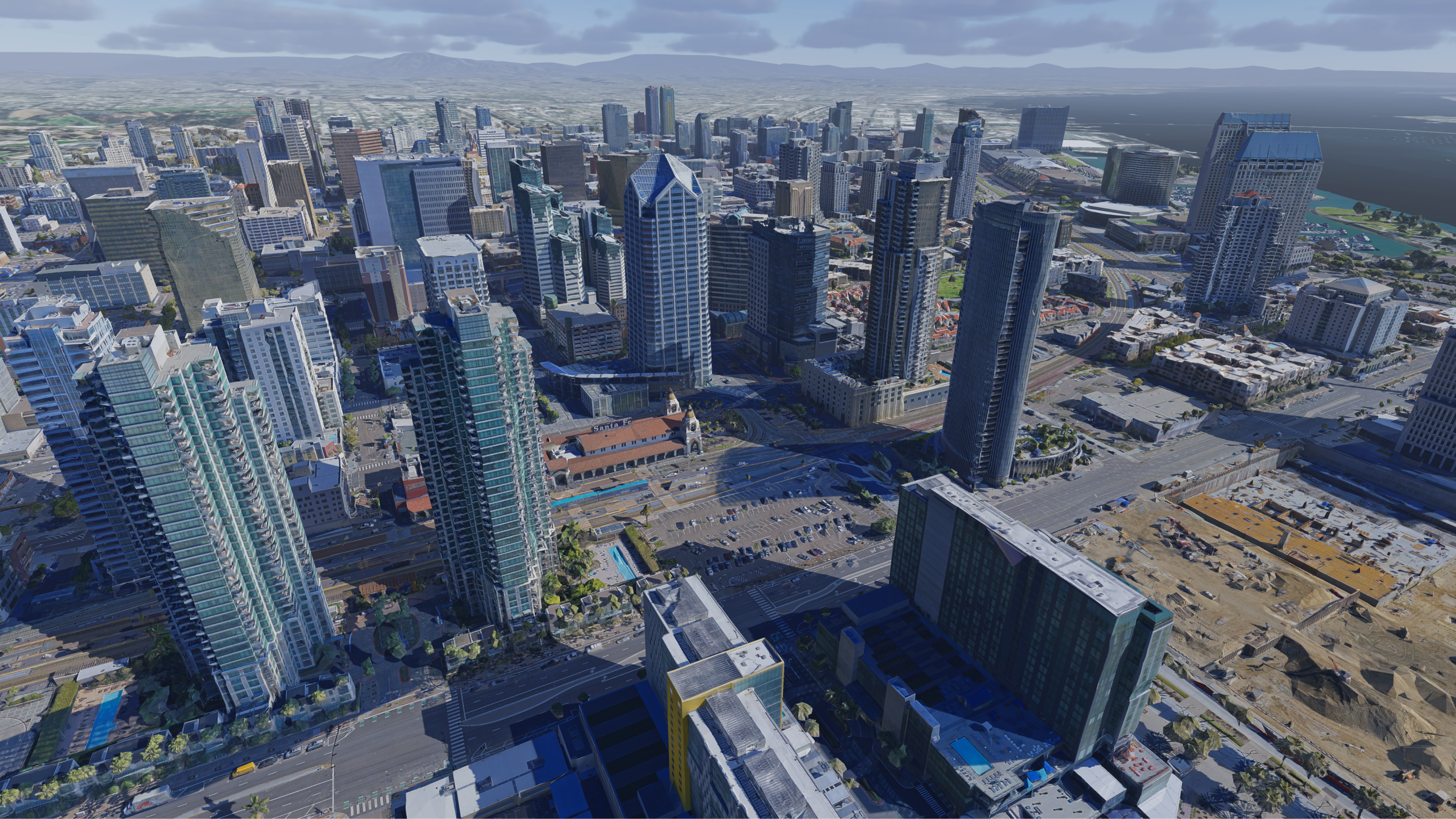 Vue aérienne d’un centre-ville avec des gratte-ciels et des constructions à l’avant-plan