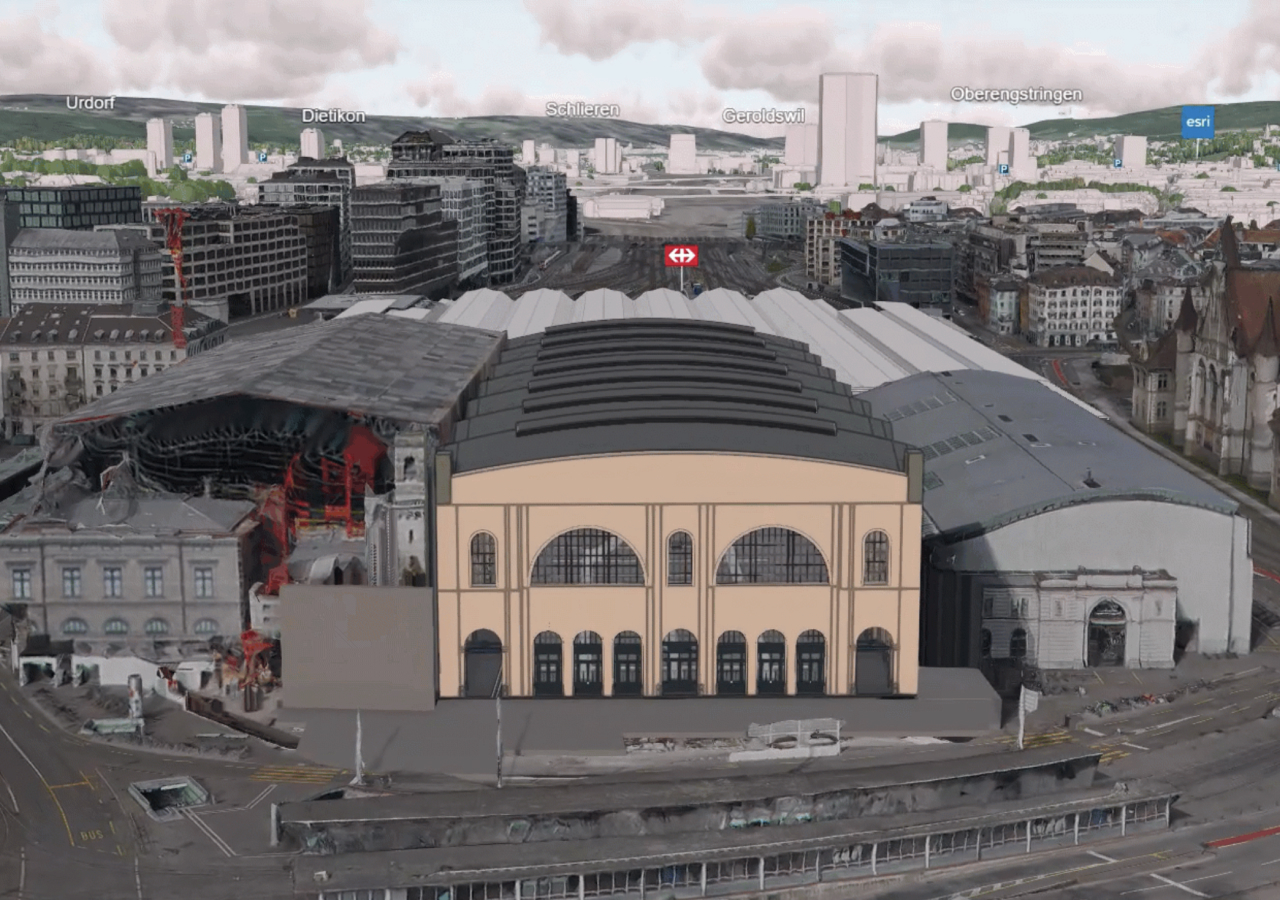 Vue 3D de bâtiments modélisés pour la construction avec des étiquettes de noms au loin, notamment Esri et Urdorf