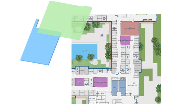 Carte indoor avec des points bleus et des données gérées dans un SIG pour un grand bâtiment, avec des formes colorées.