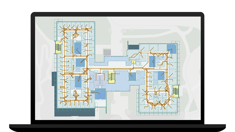 Ordinateur portable illustrant une carte indoor d’un bâtiment avec des itinéraires de sortie mis en surbrillance en jaune et marron