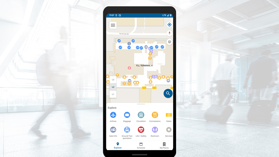 Écran de téléphone mobile représentant une carte indoor avec des cercles bleus et jaunes dispersés et des icônes rondes