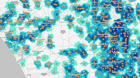 Carte de densité en bleu et vert sur un fond blanc, tachetée de points orange